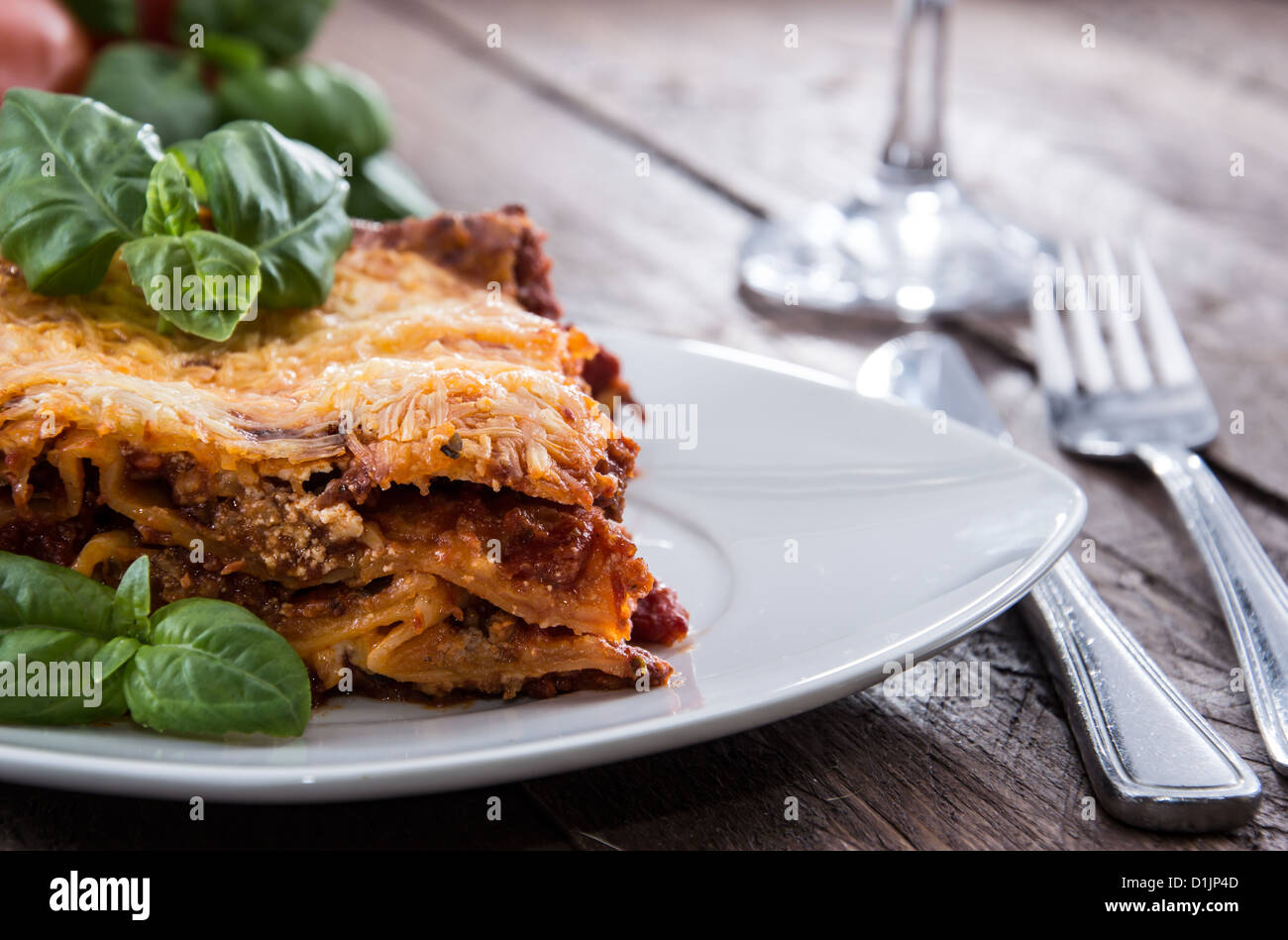 Fresh made Lasagne on a plate decorated with basil Stock Photo Alamy