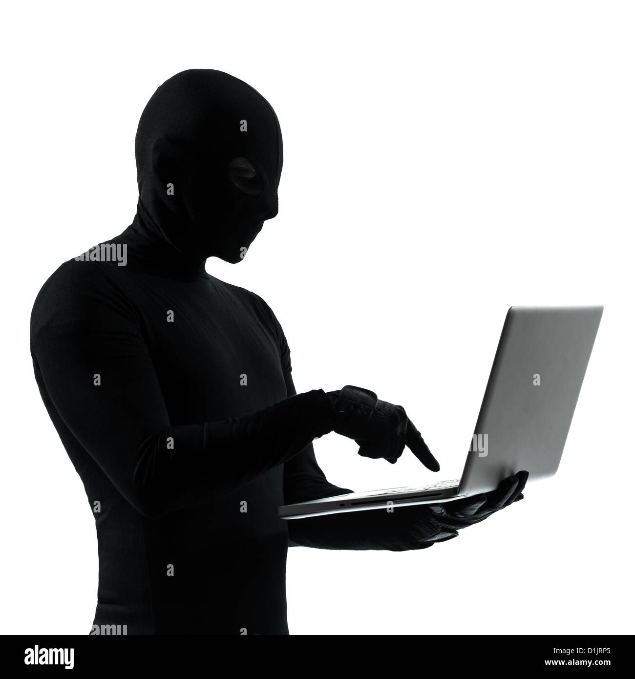 thief criminal computer hacker in silhouette studio isolated on white background Stock Photo