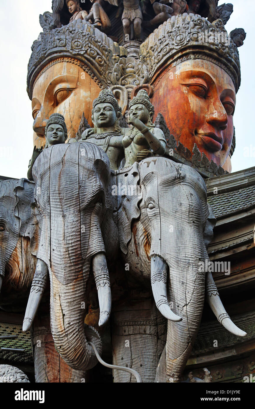 Wooden carving on the Sanctuary of Truth Temple, Prasat Sut Ja-Tum, Pattaya, Thailand showing a wood statue of a face and elepha Stock Photo