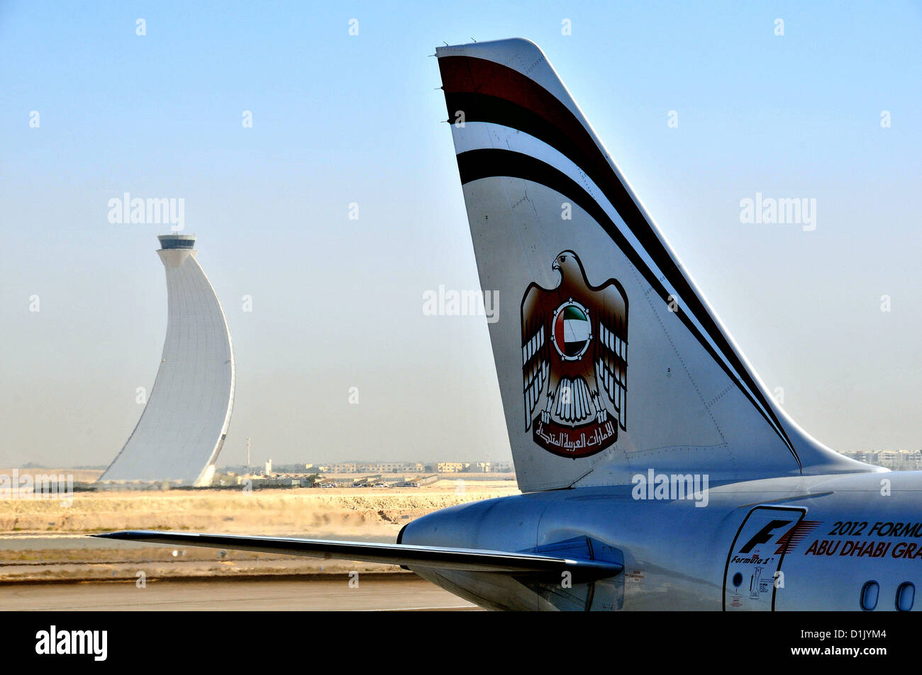 control tower aud tail of Etihad Airways plane, Abu Dhabi international airport, UAE Stock Photo