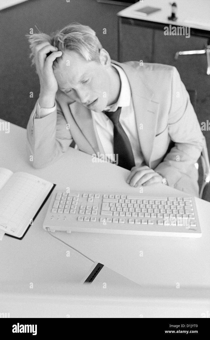 black and white business manager frustration stress businessman stressed License free except ads and billboards Stock Photo