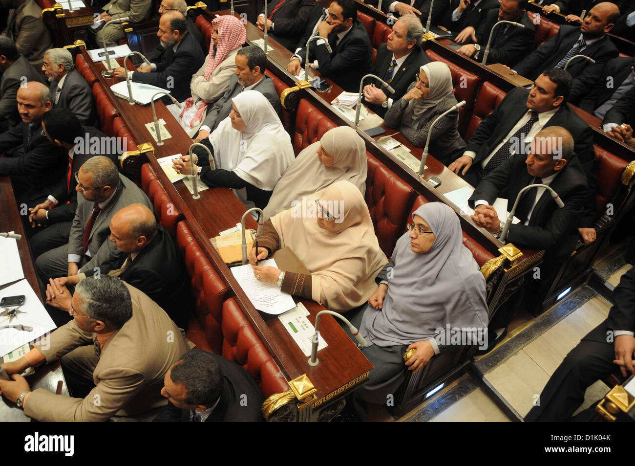 Dec. 26, 2012 - Cairo, Cairo, Egypt - Members of the Egyptian Shura Council (Upper house of the parliament), attend the first meeting after approving the new constitution, in Cairo, Egypt, 26 December 2012. According to the new constitution, the Islamist-dominated Shura Council will assume the legislative power for the first time in 32 years. Official results on 25 December showed that the Egyptian new constitution, favored by supporters of Islamist President Mohamed Morsi, was approved by 63.8 per cent of voters in a two-round referendum  (Credit Image: © Ashraf Amra/APA Images/ZUMAPRESS.com) Stock Photo