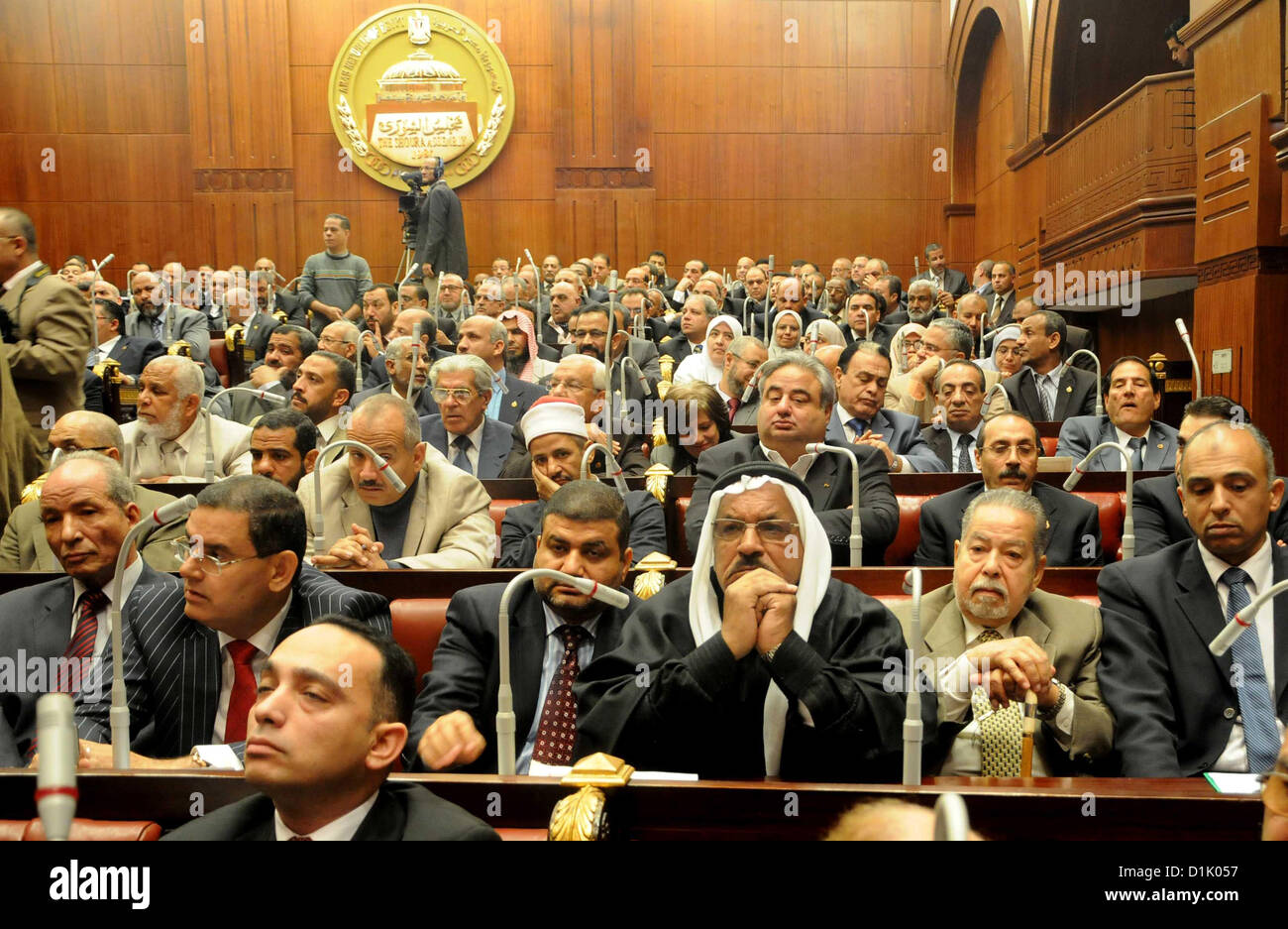 Dec. 26, 2012 - Cairo, Cairo, Egypt - Members of the Egyptian Shura Council (Upper house of the parliament), attend the first meeting after approving the new constitution, in Cairo, Egypt, 26 December 2012. According to the new constitution, the Islamist-dominated Shura Council will assume the legislative power for the first time in 32 years. Official results on 25 December showed that the Egyptian new constitution, favored by supporters of Islamist President Mohamed Morsi, was approved by 63.8 per cent of voters in a two-round referendum  (Credit Image: © Ashraf Amra/APA Images/ZUMAPRESS.com) Stock Photo