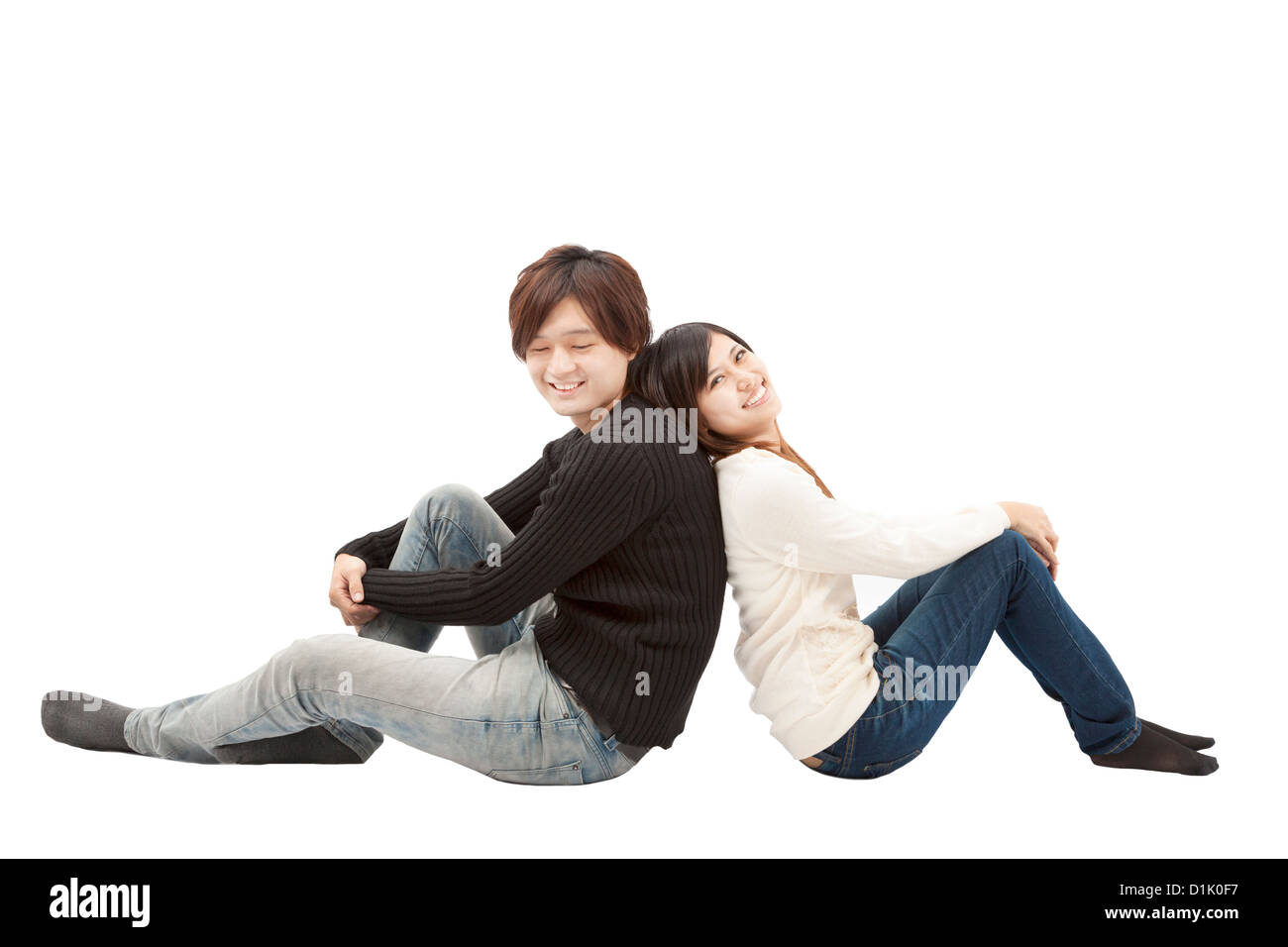 young asian couple sitting together and isolated on white Stock Photo