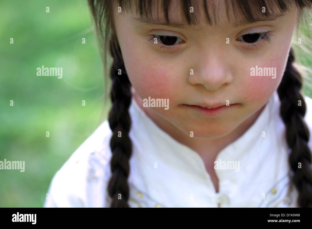 Portrait of beautiful young girl on the green background Stock Photo ...