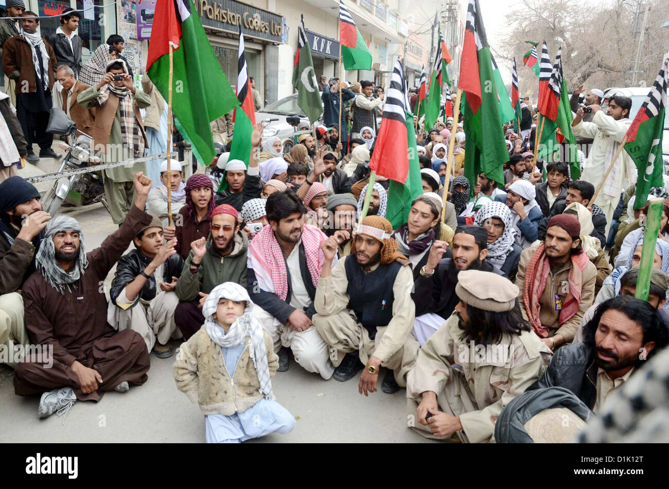 Activists of Ahle Sunnat Wal Jamat (Defunct Sipah-e-Sahaba)  chant slogans against an assassination attack on their leader Aurangzeb Farooqi convoy and  killing of his seven gunmen and driver, during protest demonstration at Quetta press club on  Wednesday, December 26, 2012 Stock Photo