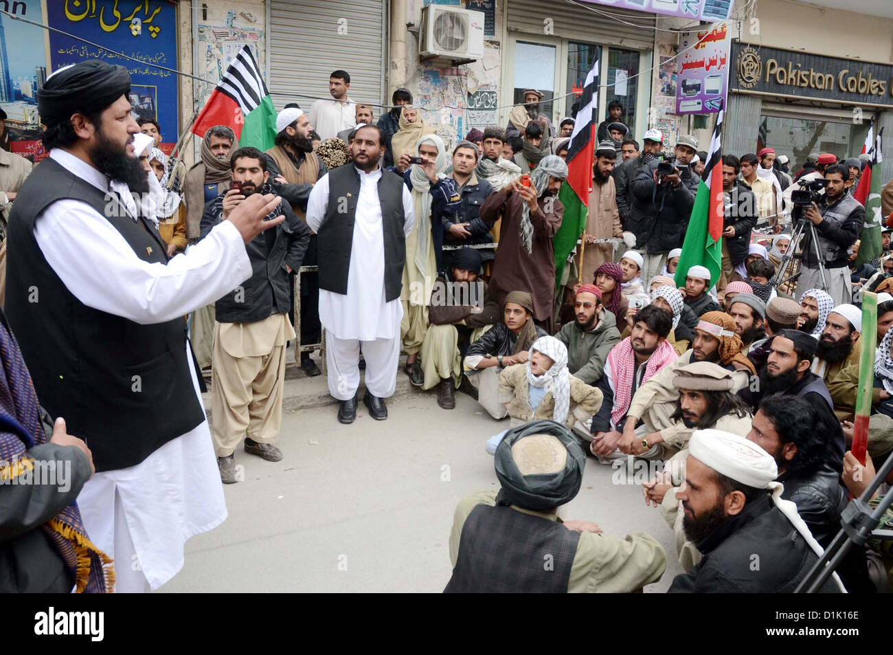 Activists of Ahle Sunnat Wal Jamat (Defunct Sipah-e-Sahaba)  chant slogans against an assassination attack on their leader Aurangzeb Farooqi convoy and  killing of his seven gunmen and driver, during protest demonstration at Quetta press club on  Wednesday, December 26, 2012. Stock Photo
