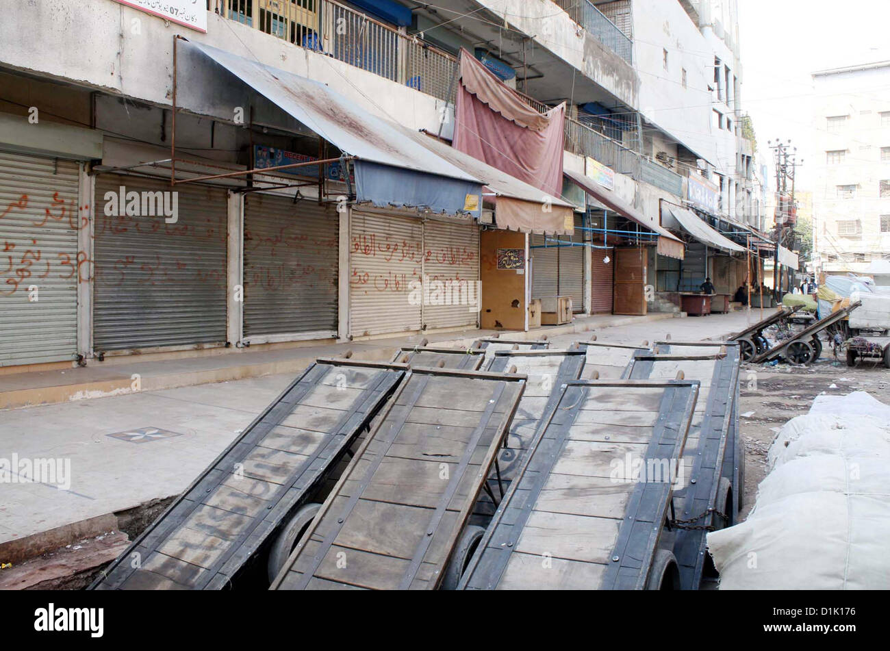 Shops are seen closed during strike called by Ahle Sunnat  Wal Jamat (Defunct Sipah-e-Sahaba) against an assassination attack on their leader Aurangzeb  Farooqi convoy and killing of his seven gunmen and driver, at Bolton Market area in Karachi on  Wednesday, December 26, 2012. Stock Photo