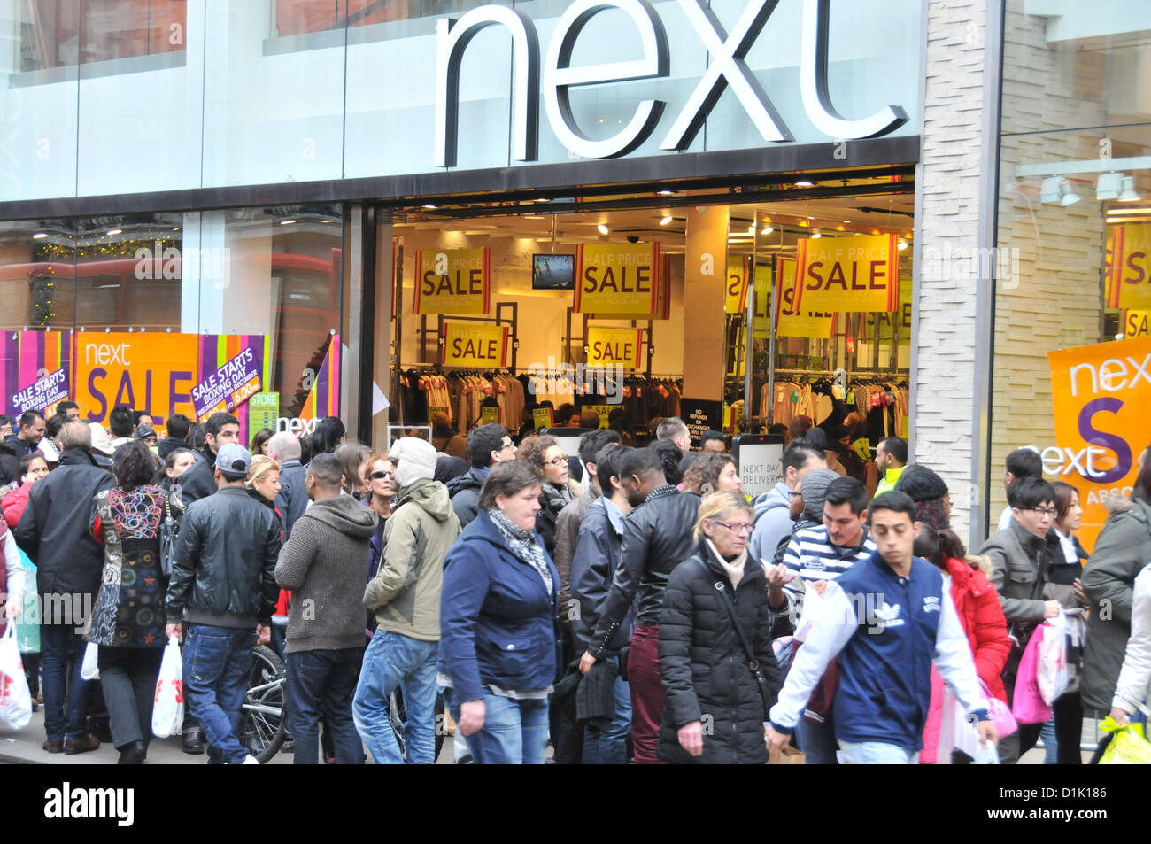 Oxford Street, London, UK. 26th December 2012. Boxing Day shoppers outside Next on Oxford Street. Shoppers fill the streets at the Boxing Day sales in central London. Credit:  Matthew Chattle / Alamy Live News Stock Photo