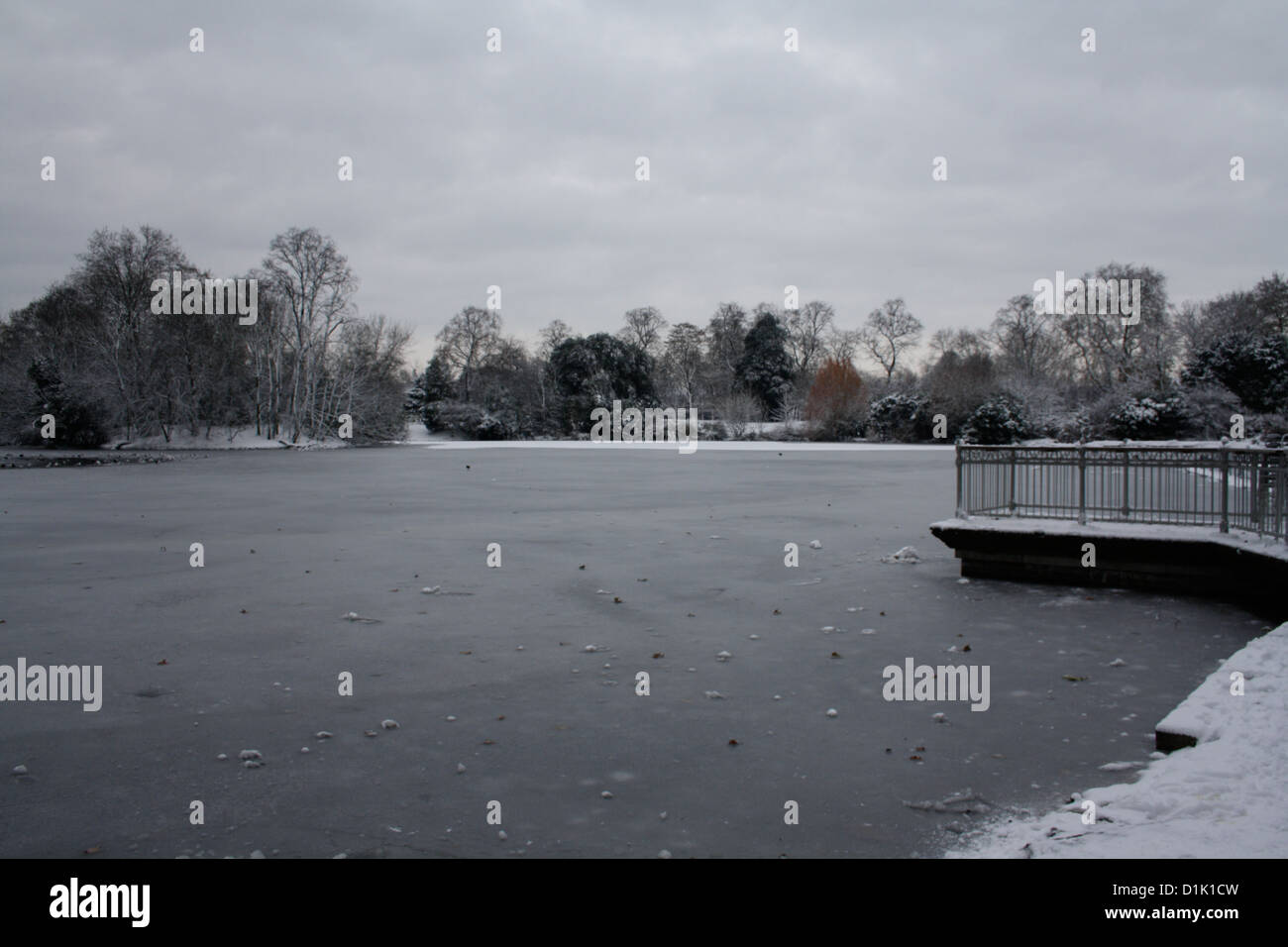 The lake at Victoria Park, east London, frozen during winter Stock Photo