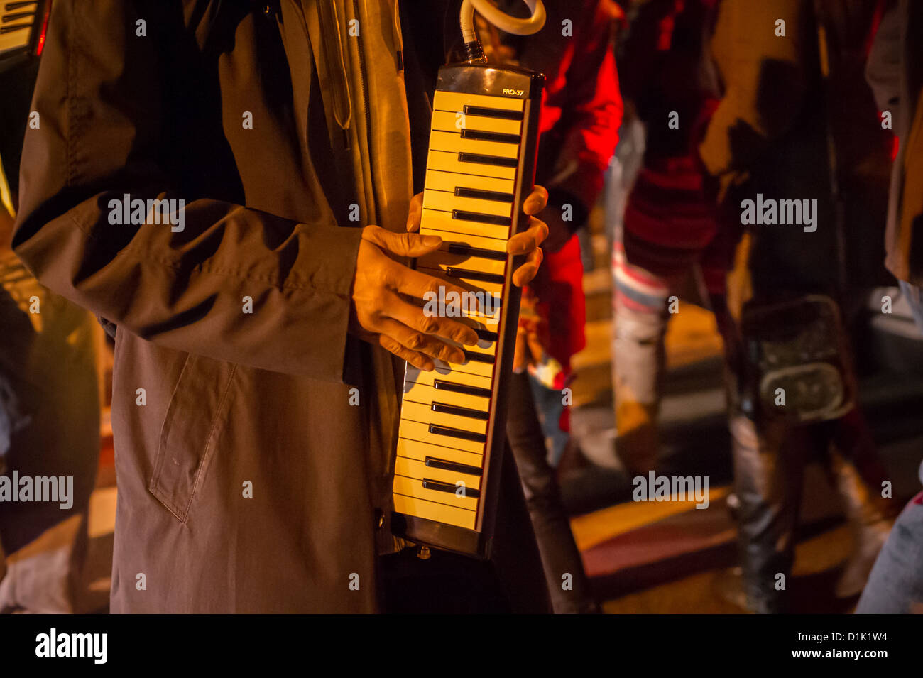 Jazz musicians playing harmonabords (also known as melodicas) and other