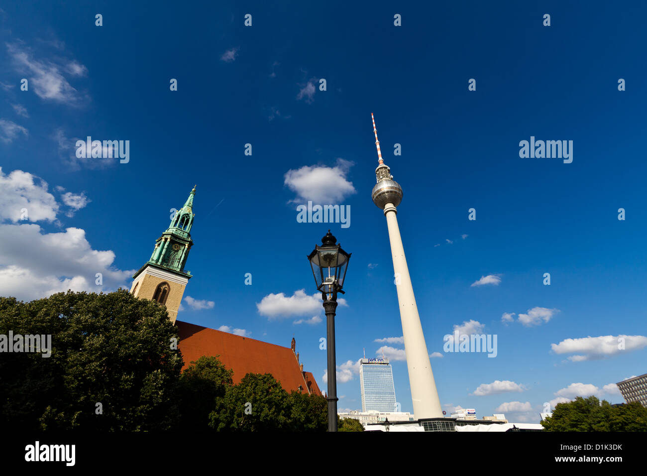 St. Mary's Church and the Television Tower on Alexanderplatz in Berlin, Germany Stock Photo