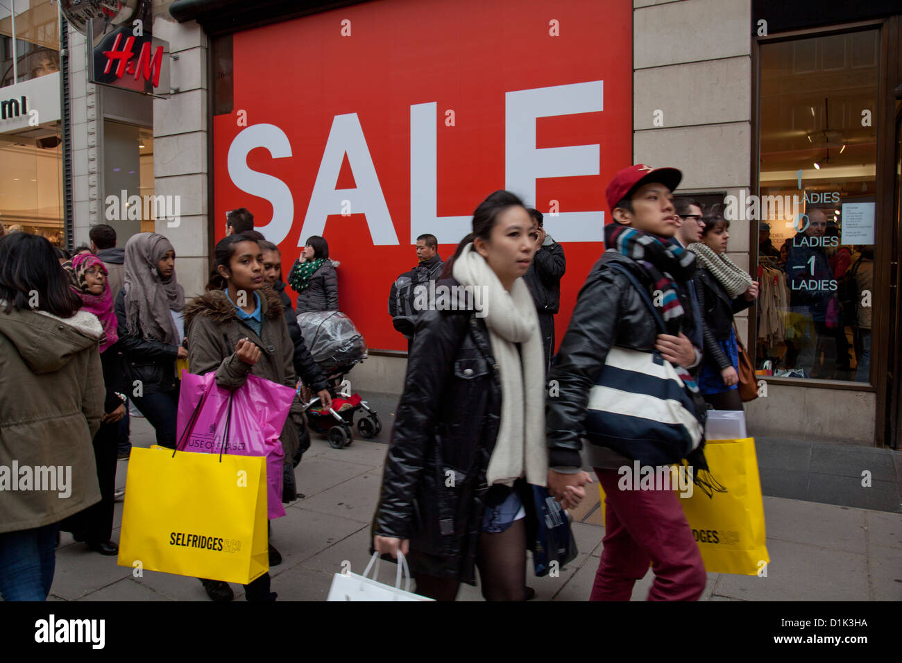 Tourists and shoppers at sales in department stores in Oxford St