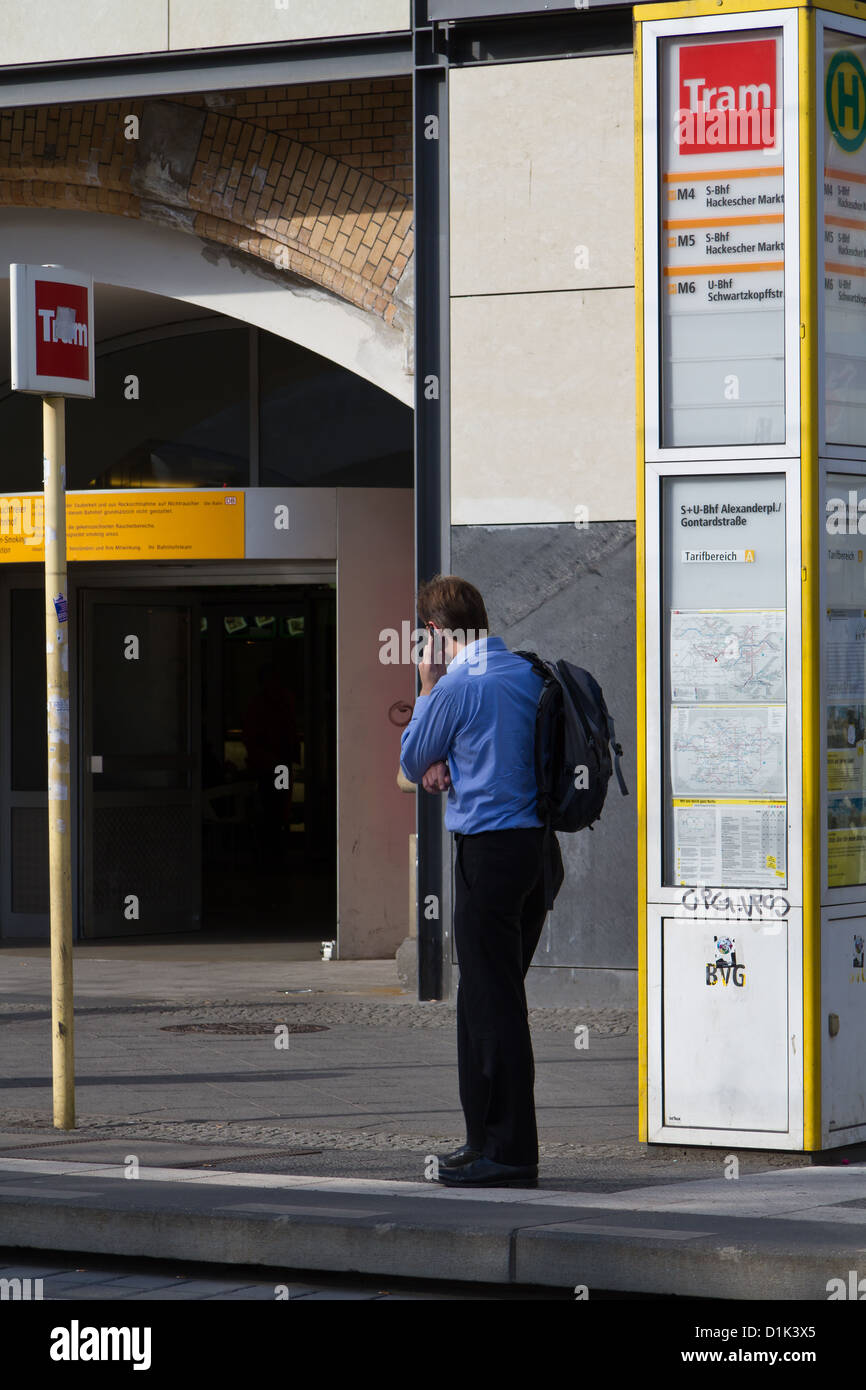 Man at a Tram Stop at Alexanderplatz in Berlin, Germany Stock Photo