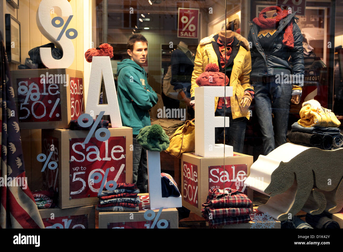 Sales 50% discount, shop window display sale fifty percent discount menswear Stock Photo