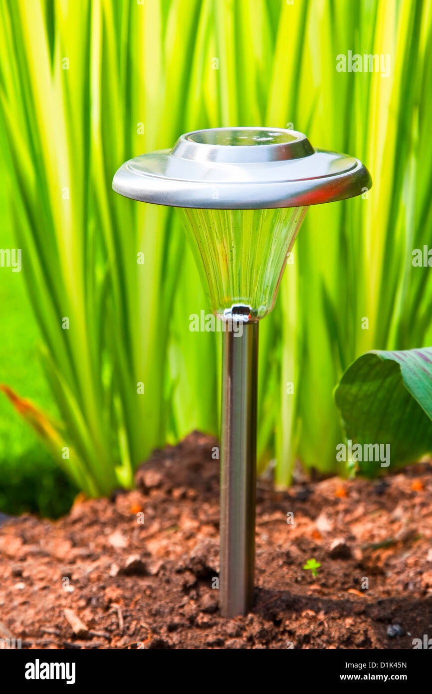 Solar garden light in the home garden Stock Photo Alamy