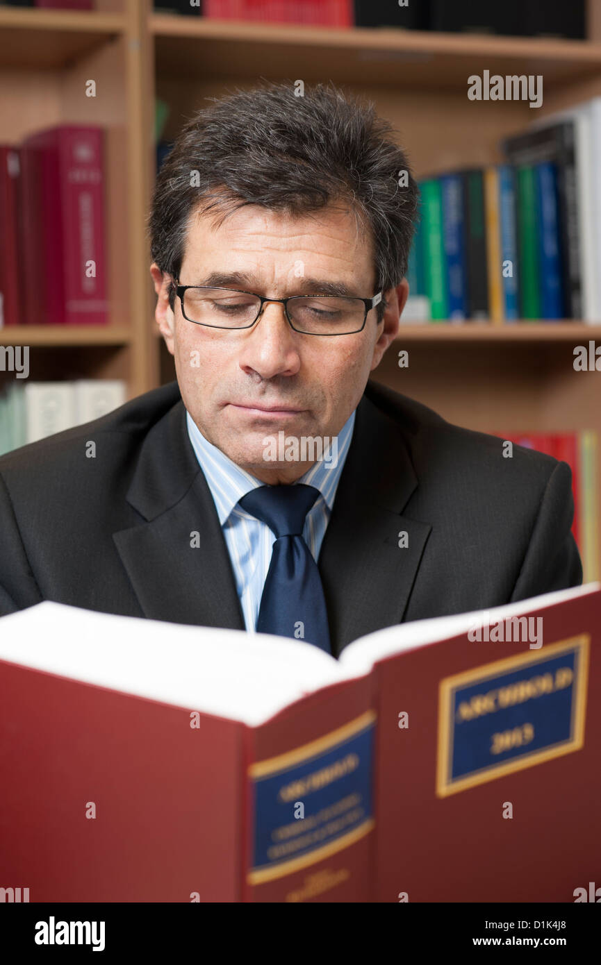 Environmental corporate portrait of solicitor, lawyer, attorney reading