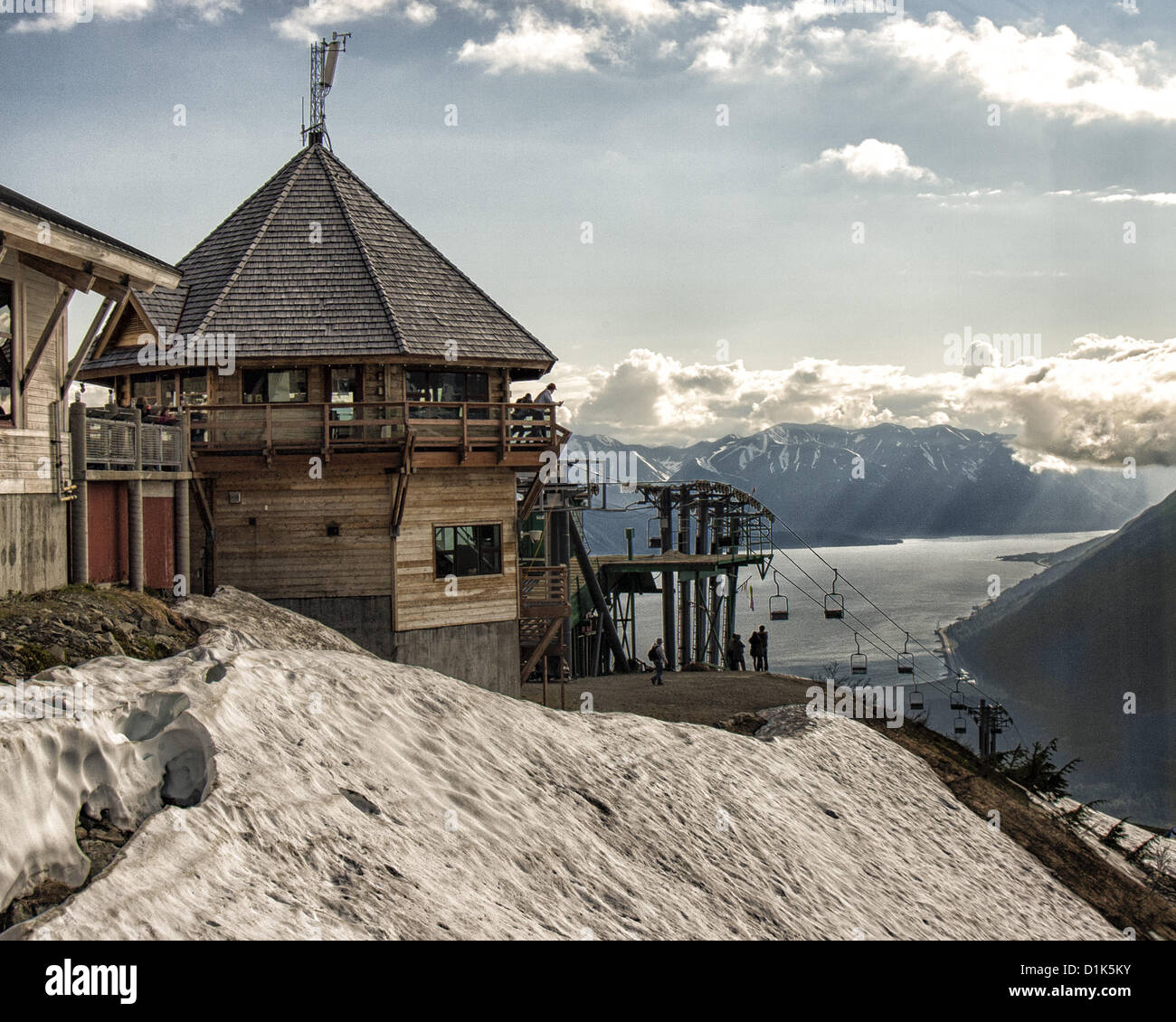 June 30, 2012 - Girdwood, Alaska, US - The Roundhouse, one of the interconnected buildings of the Mt Alyeska Upper Tram Terminal, 2,334 ft (711 m) above sea level, with its sweeping view in the distance of the dramatic Kenai Mountain Range and Turnagain Arm, a 50 mi [80 km] fjord fed by Cook Inlet. Located in Girdwood, Alaska, 27 miles (44Â km) from Anchorage, Mt. Alyeska is the biggest ski mountain in the state. (Credit Image: © Arnold Drapkin/ZUMAPRESS.com) Stock Photo