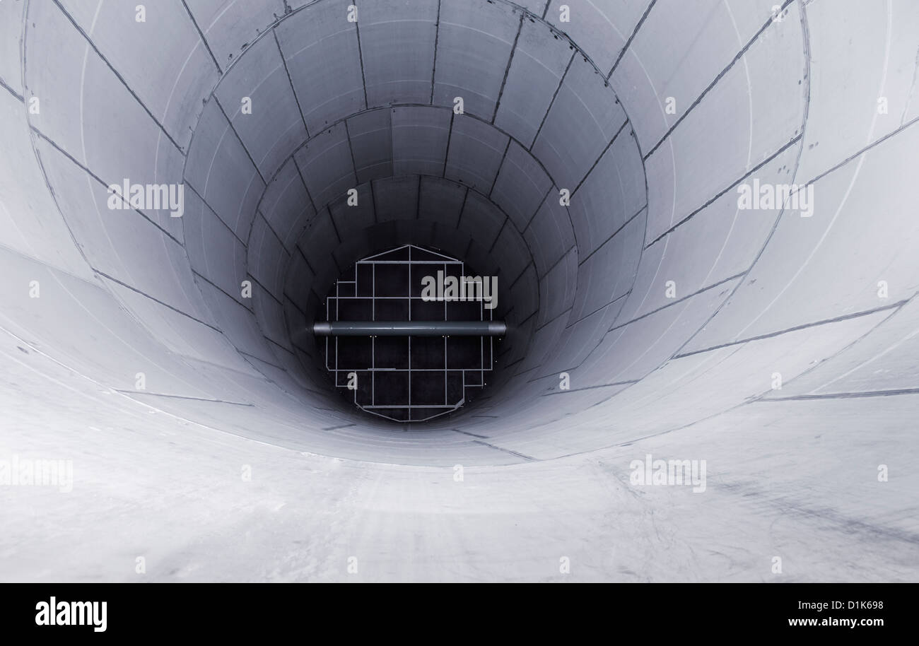 Metallic scifi background. Interior of a big stainless steel chemical reactor. Stock Photo