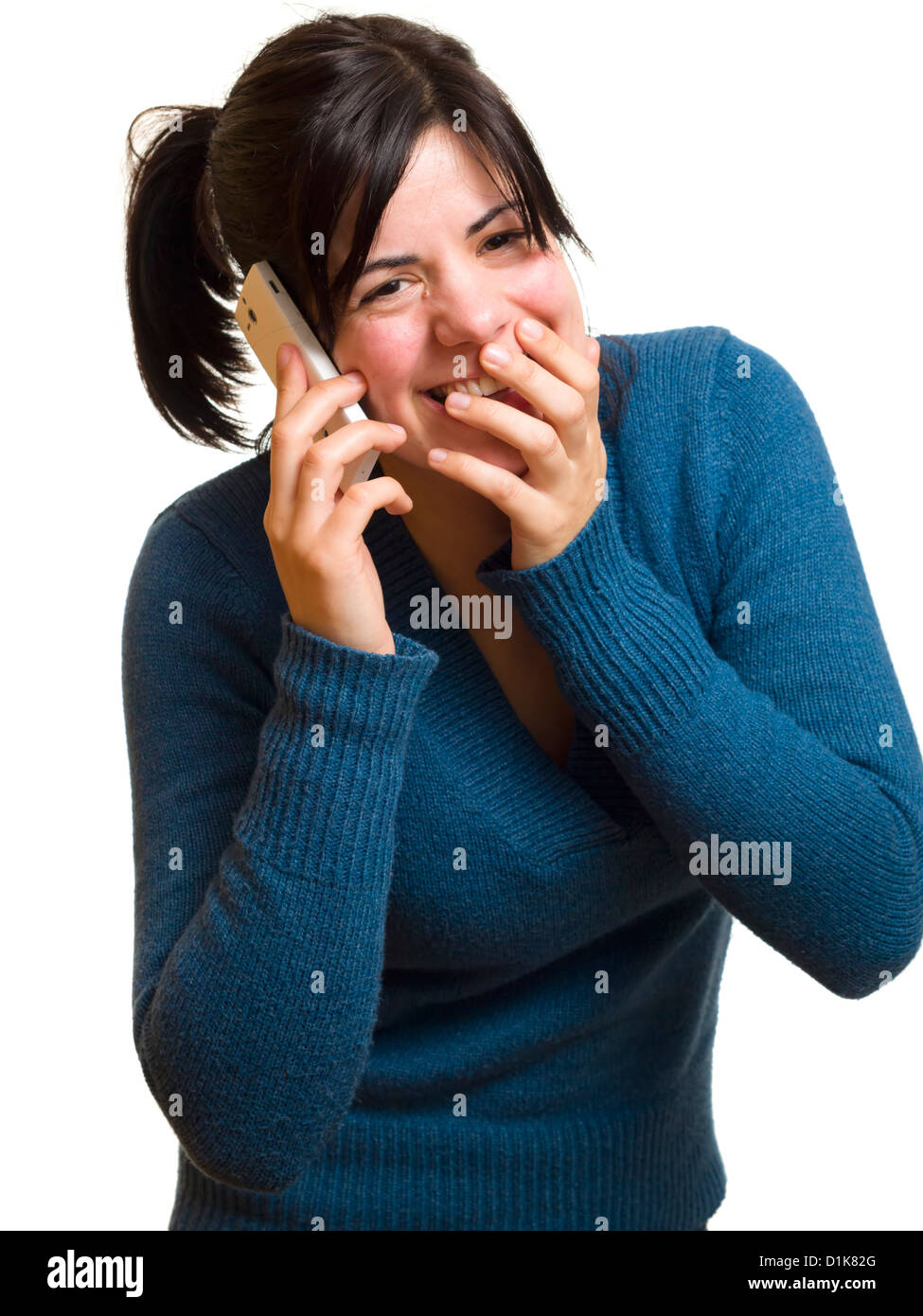 Young woman talking on mobile phone and giggling Stock Photo