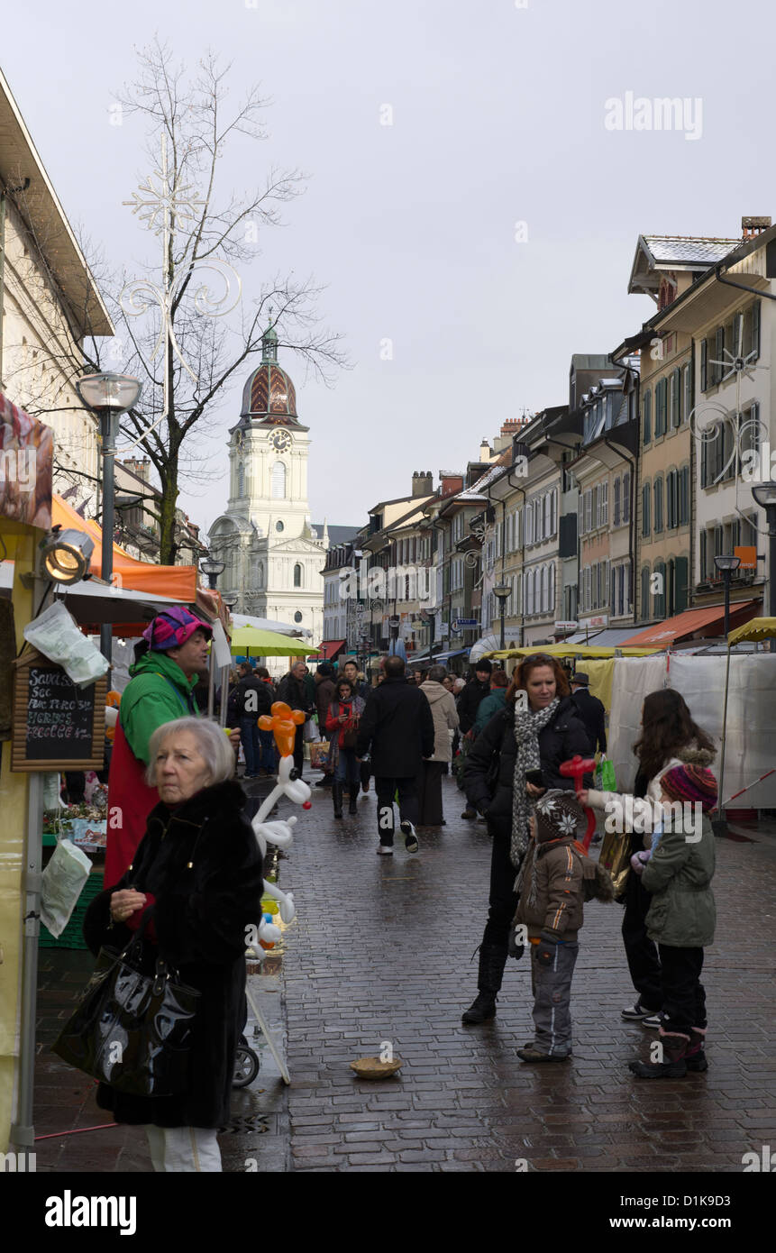 Street market in Rue Louis de Savoie, Morges Switzerland with the Temple de Morges in the background. Stock Photo