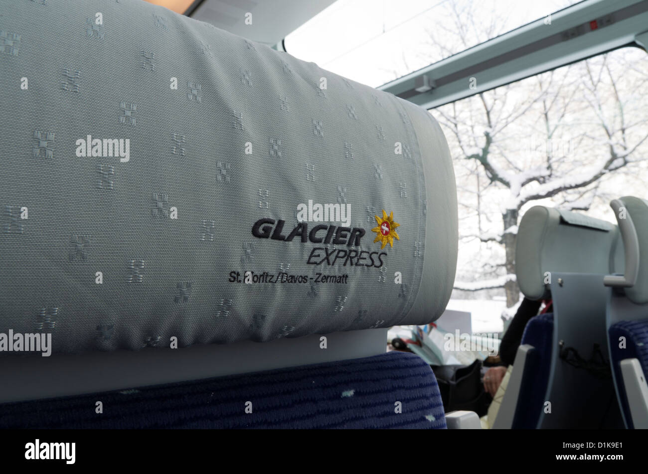 View of headrest and logo inside the Glacier Express Train as it travels between Andermatt and Brig in Switzerland. Stock Photo