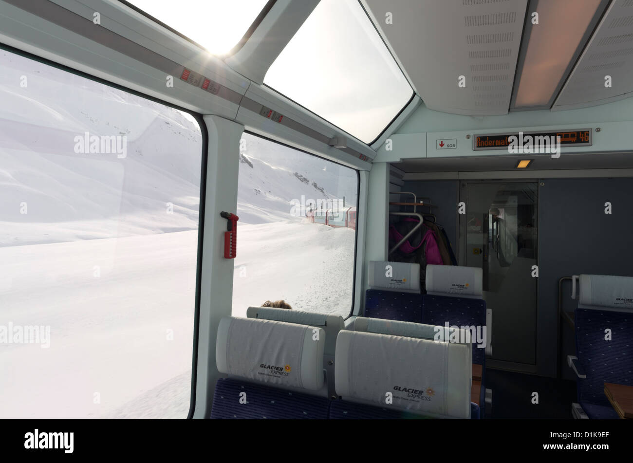 View on the Glacier Express Train as it travels trough Swizerland between Andermatt and Brig. Stock Photo