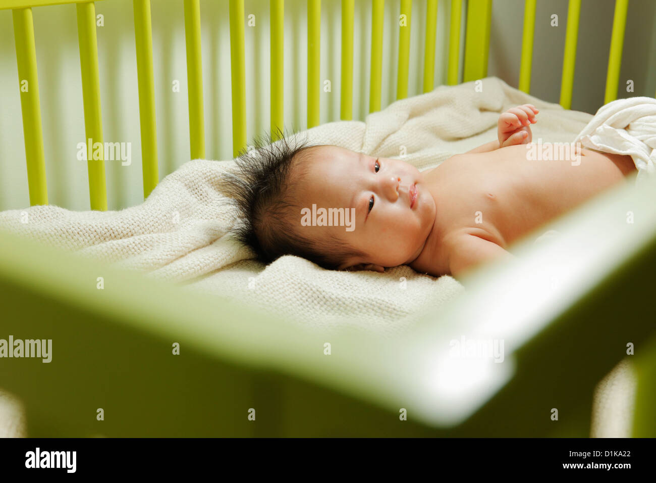 Baby sleeping in his crib Stock Photo Alamy