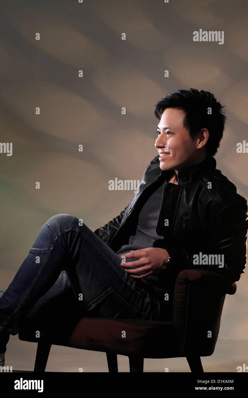 Shot young man sitting hi-res stock photography and images - Alamy