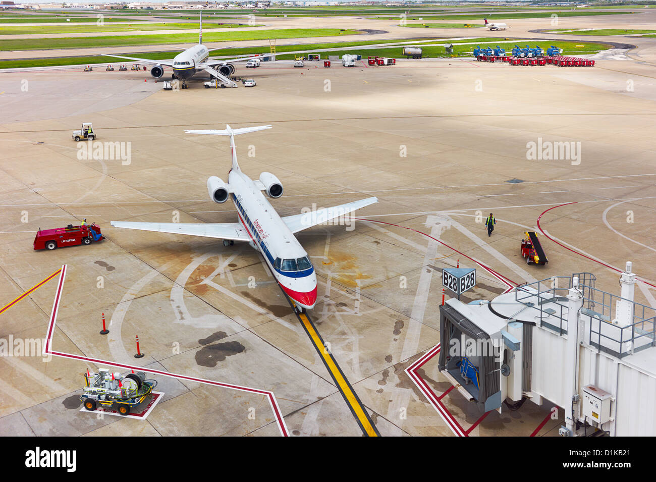 A docked small American Airlines plane parked on the tarmac Stock Photo