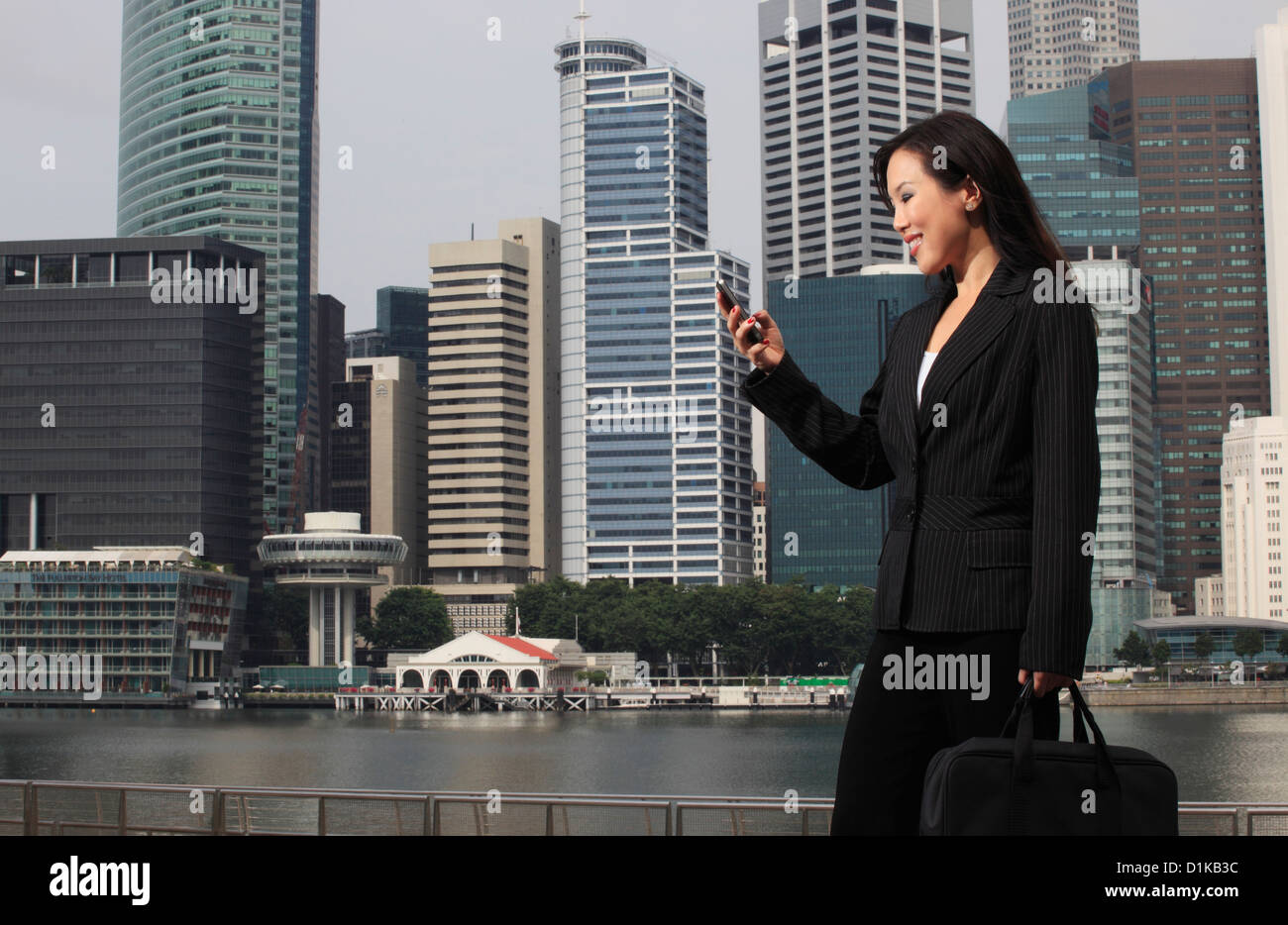 Woman wearing a business suit standing in front of buildings and ...