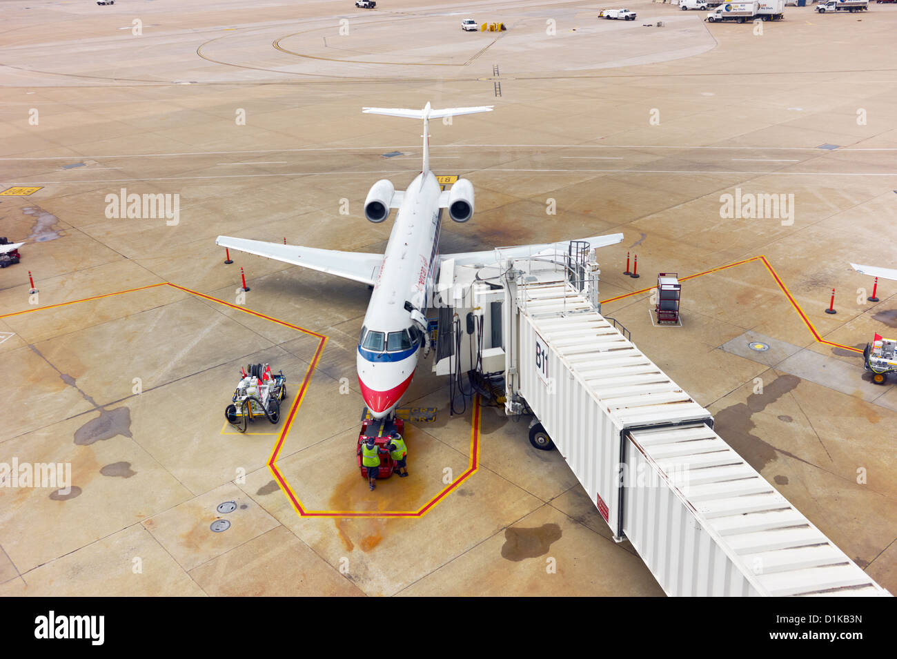 A docked small American Airlines plane parked on the tarmac Stock Photo