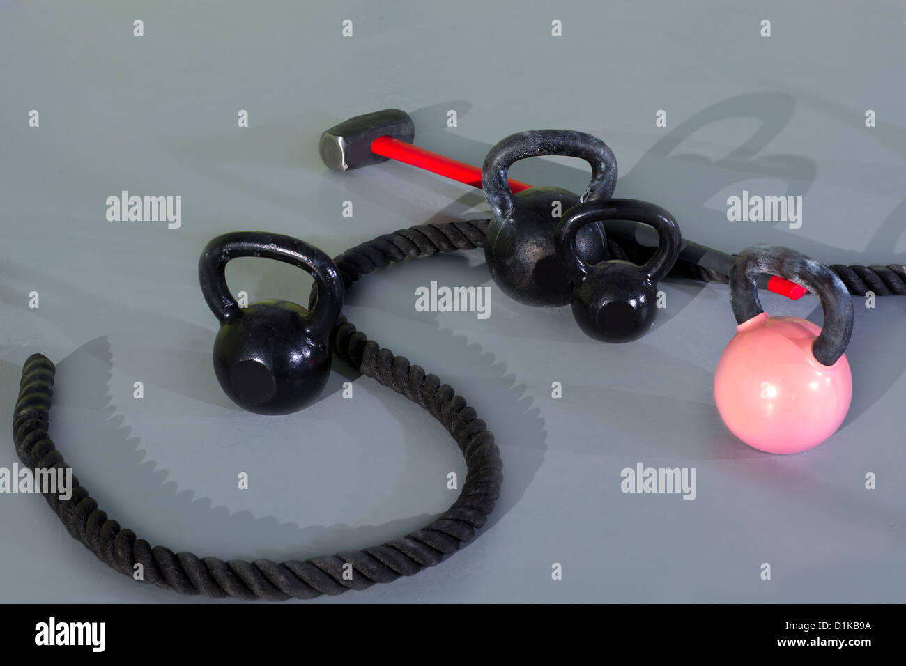 Crossfit Kettlebells ropes and hammer in fitness gym floor Stock Photo ...