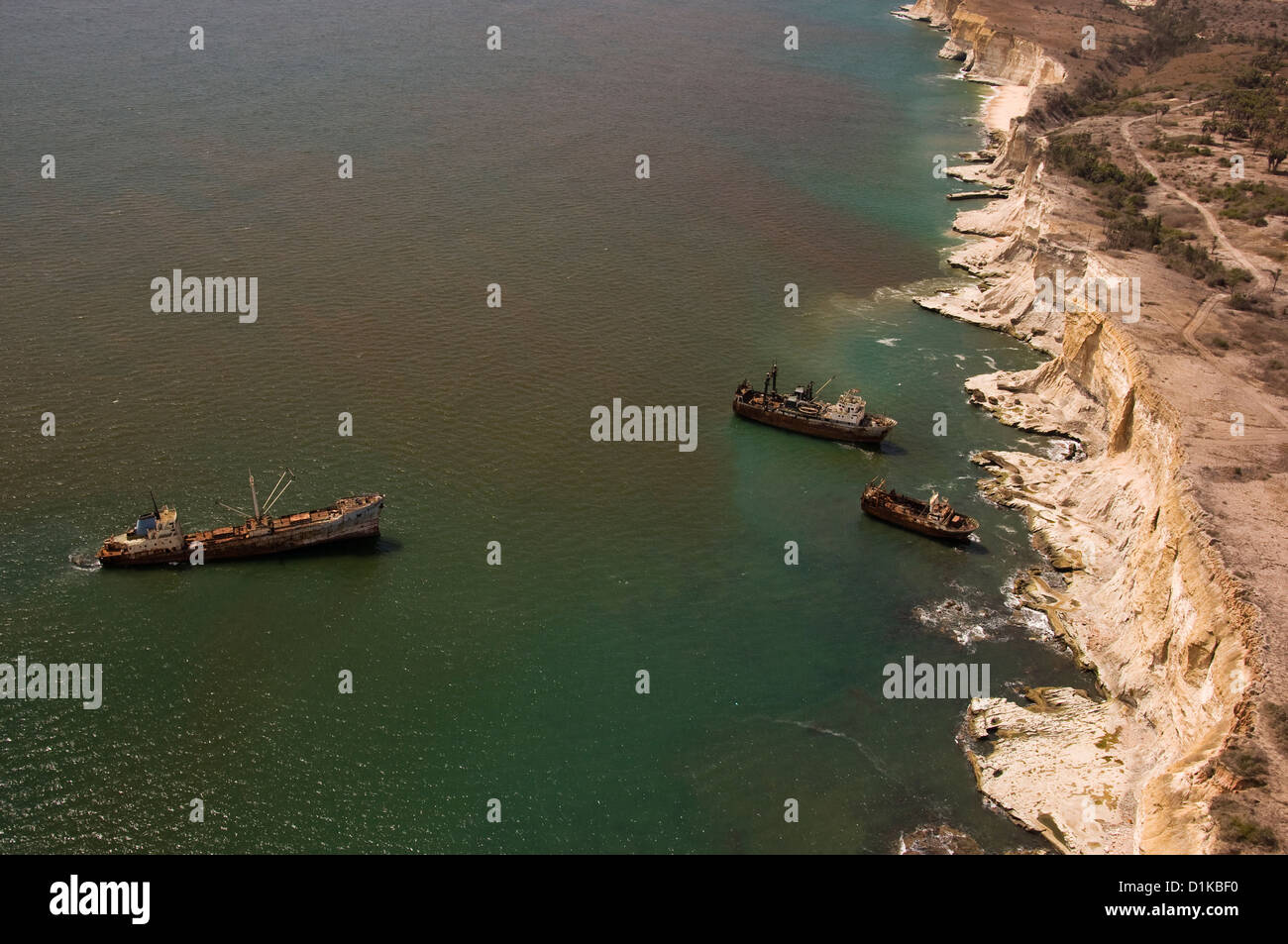 Birds eye view of a ship and two smaller vessels beached off the Angolan coastline North of the capital, Luanda. Stock Photo
