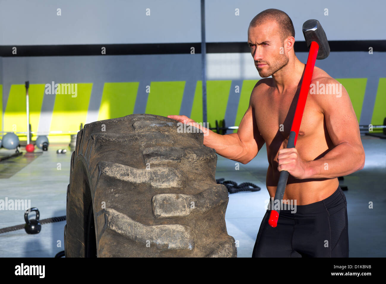 Crossfit sledge hammer man workout hires stock photography and images