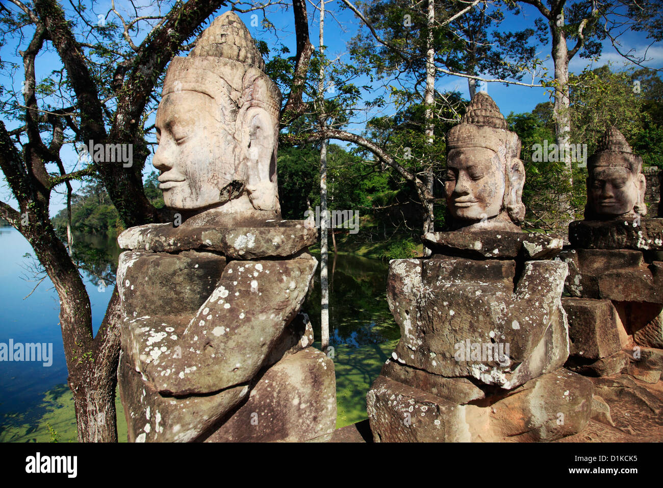 Stone carving of deities near a lake, Angkor Wat, Cambodia Stock Photo