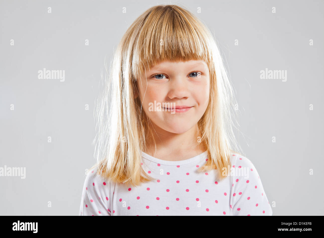 Studio portrait of happy smiling young girl Stock Photo - Alamy