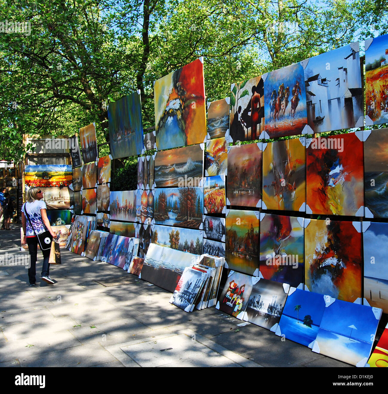 Weekly open air art market  on the railings along Green Park, Piccadilly, London, UK,  on a sunny Summer weekend. Stock Photo