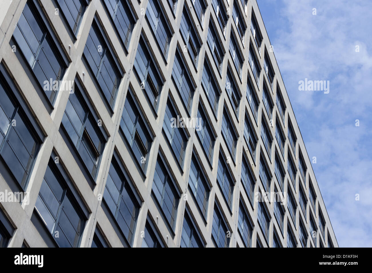Pattern of windows in a concrete building against the sky Stock Photo