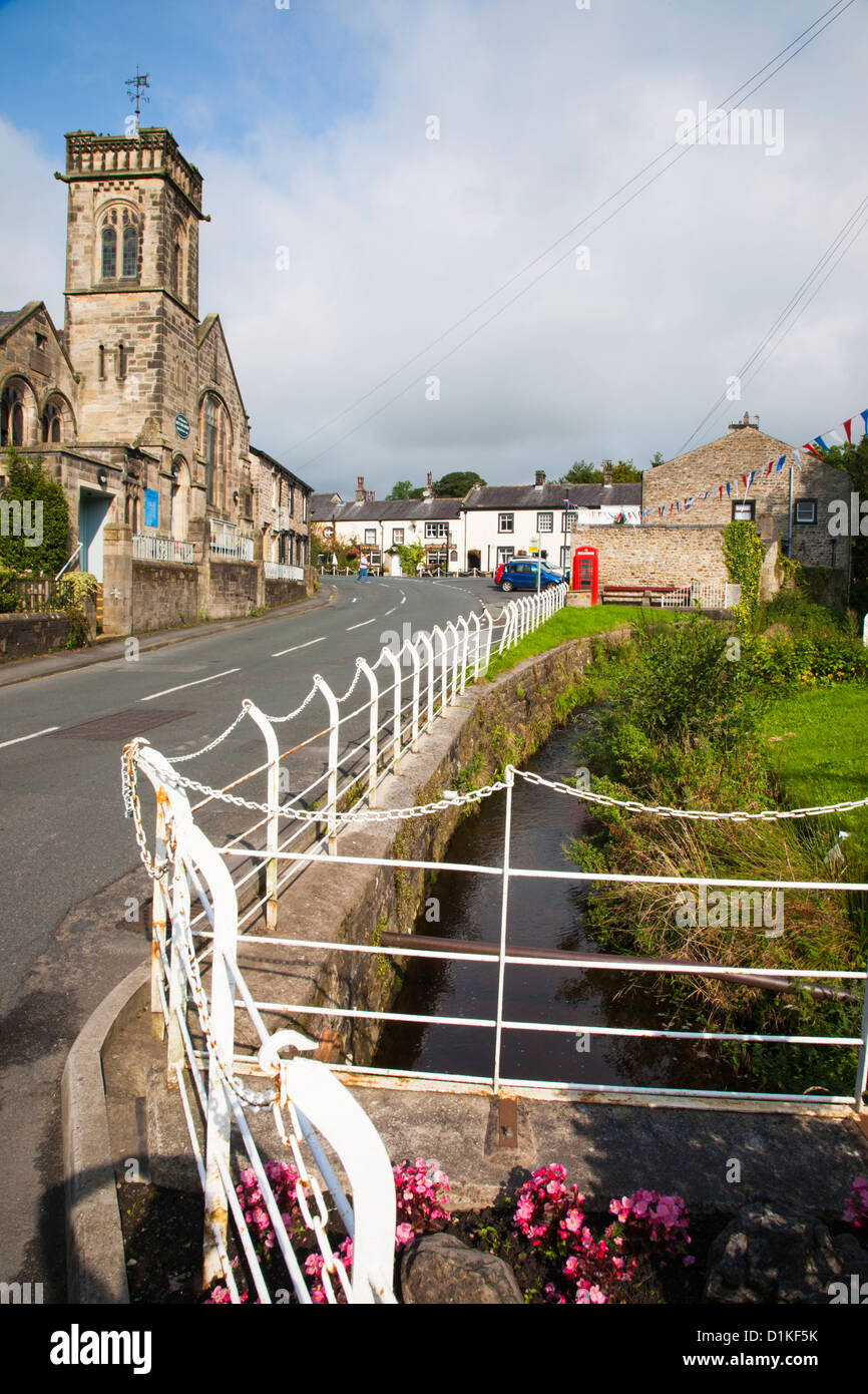 methodist church and stream running through village of Waddington in Lancashire Stock Photo