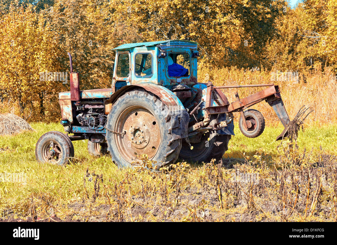 Old tractor in the field Stock Photo - Alamy