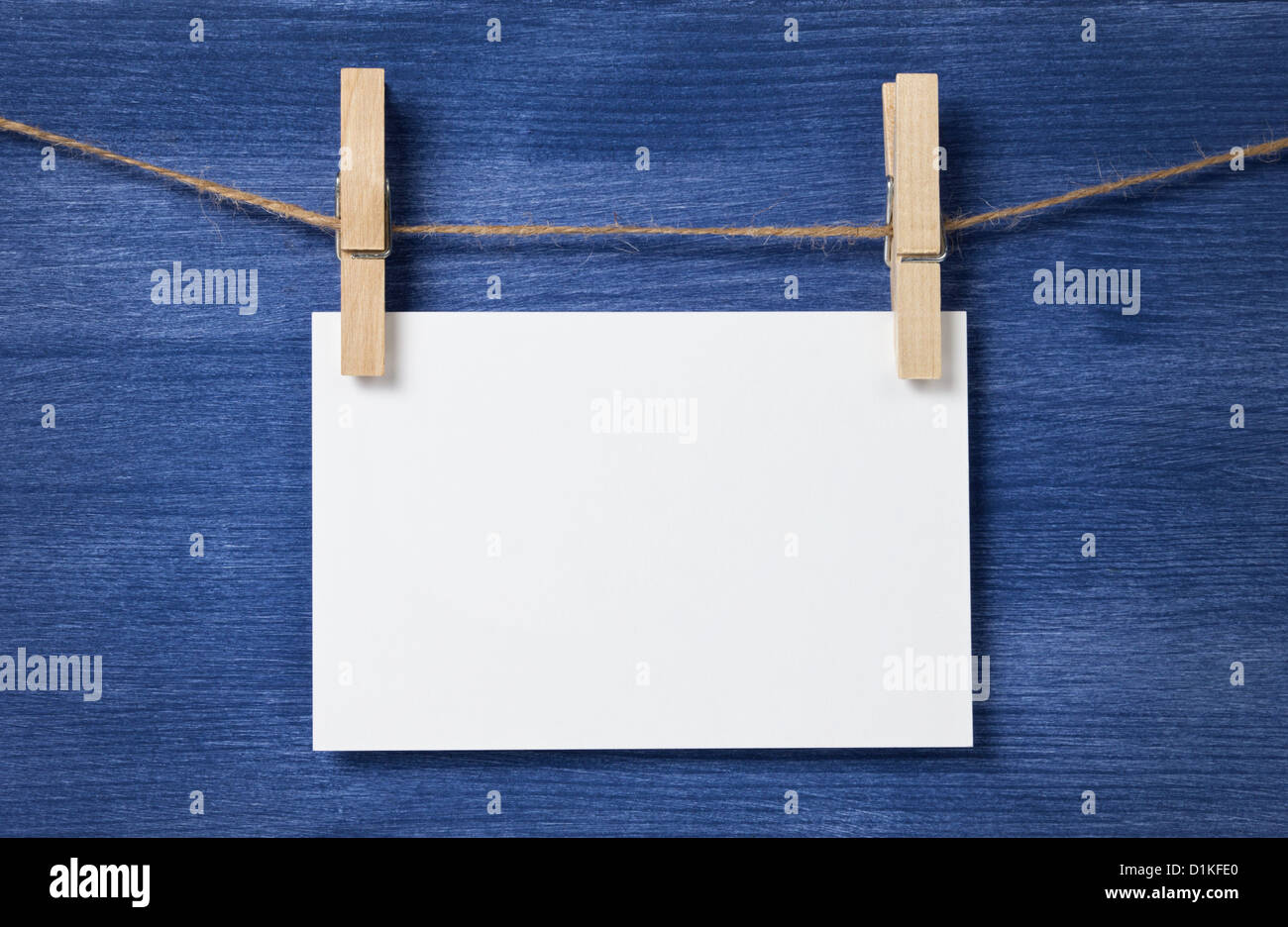 white blank paper card hanging over wood background, template Stock ...