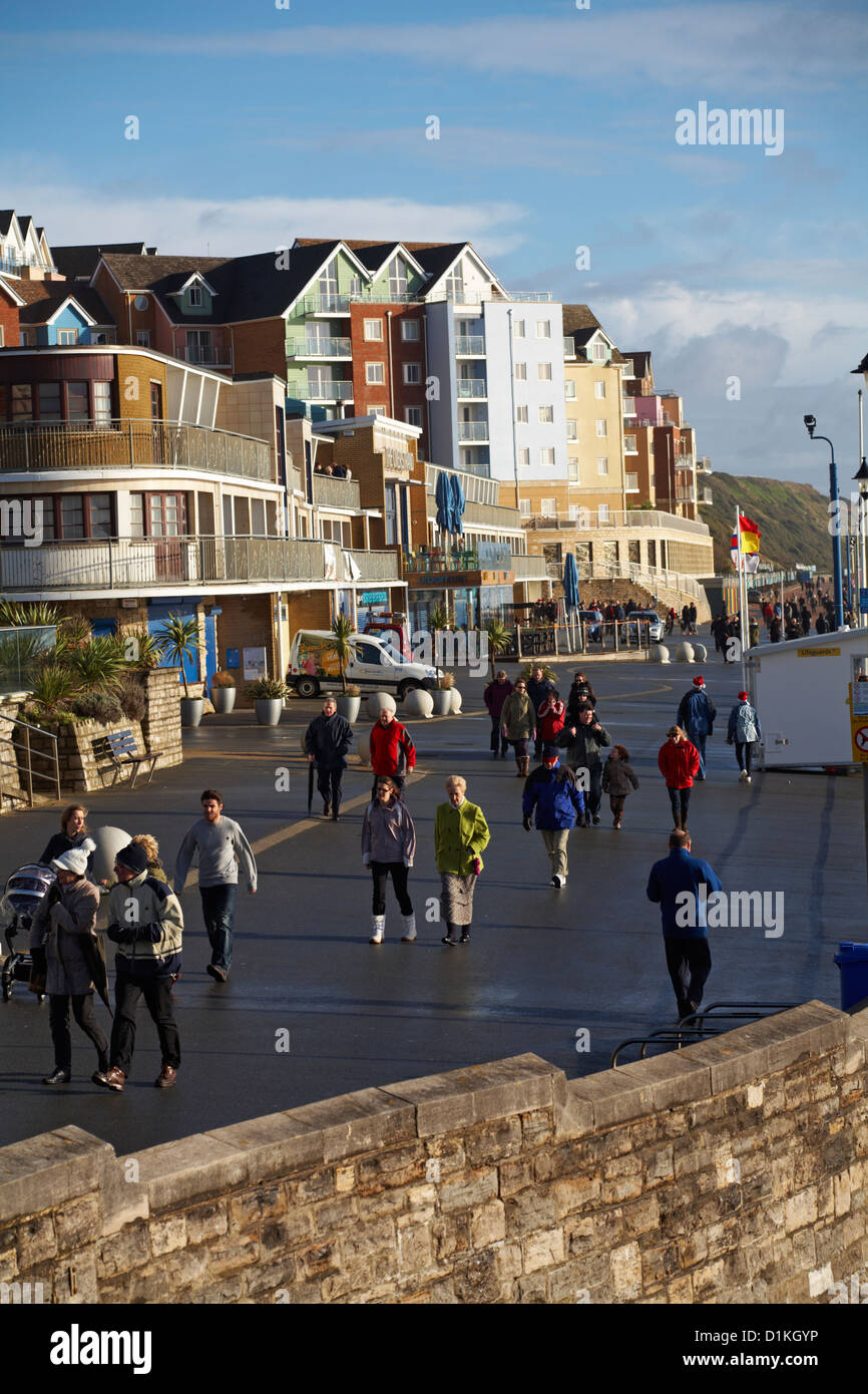 crowds walk along the seafront at The Overstrand Boscombe on Christmas day Stock Photo