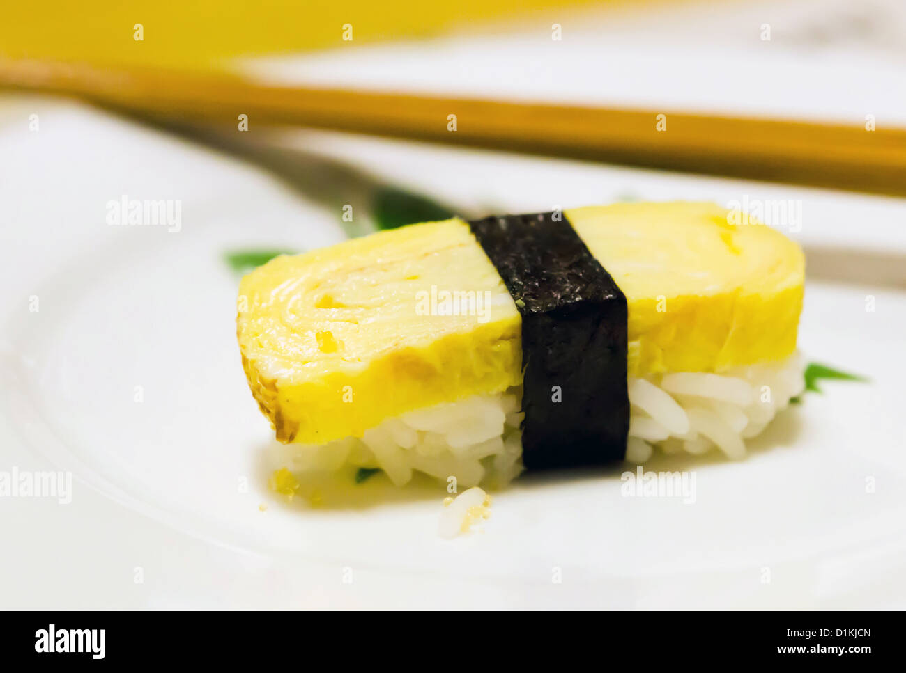 Tamago yaki is sushi using an egg on white plate Stock Photo