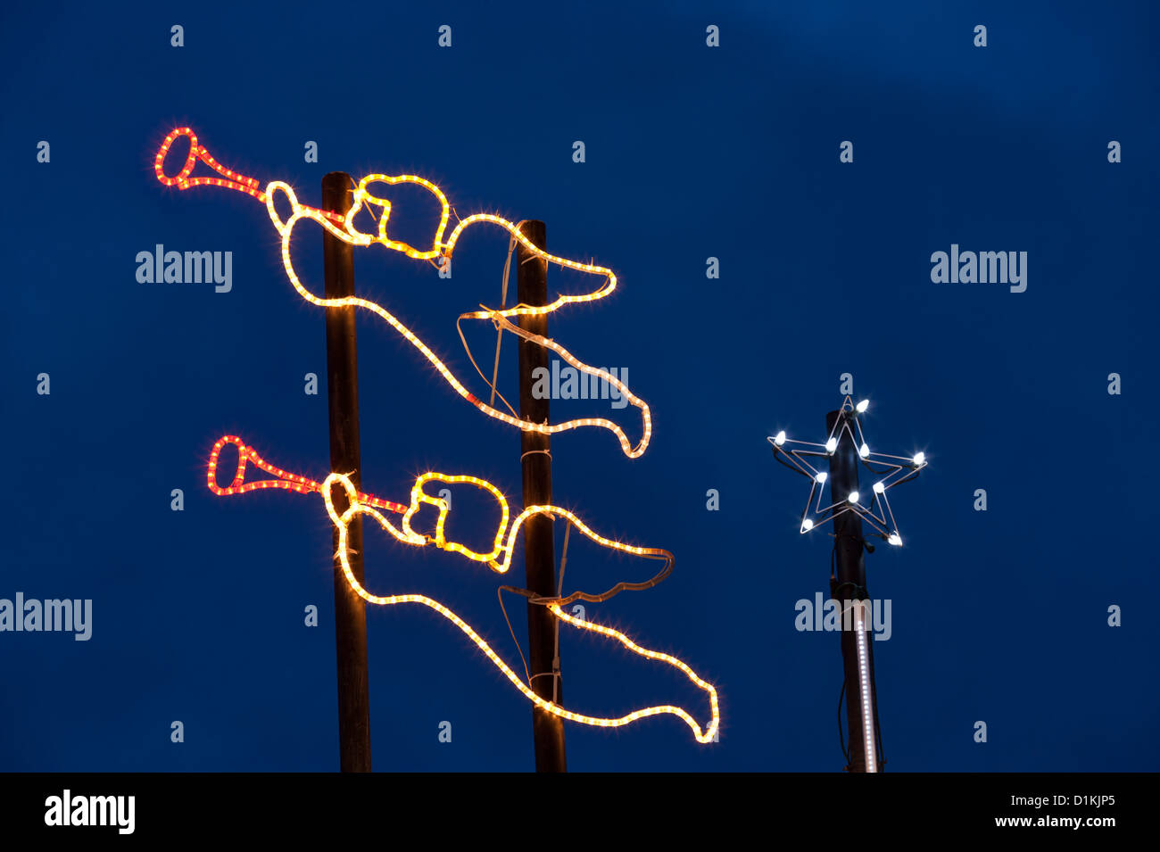 Angels playing trumpets on house lit up for annual Christmas season.-Victoria, British Columbia, Canada. Stock Photo