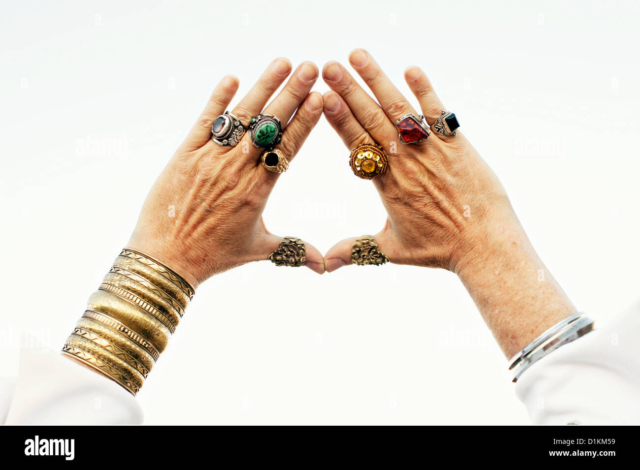Bejeweled mature male hands framing a vision. Stock Photo