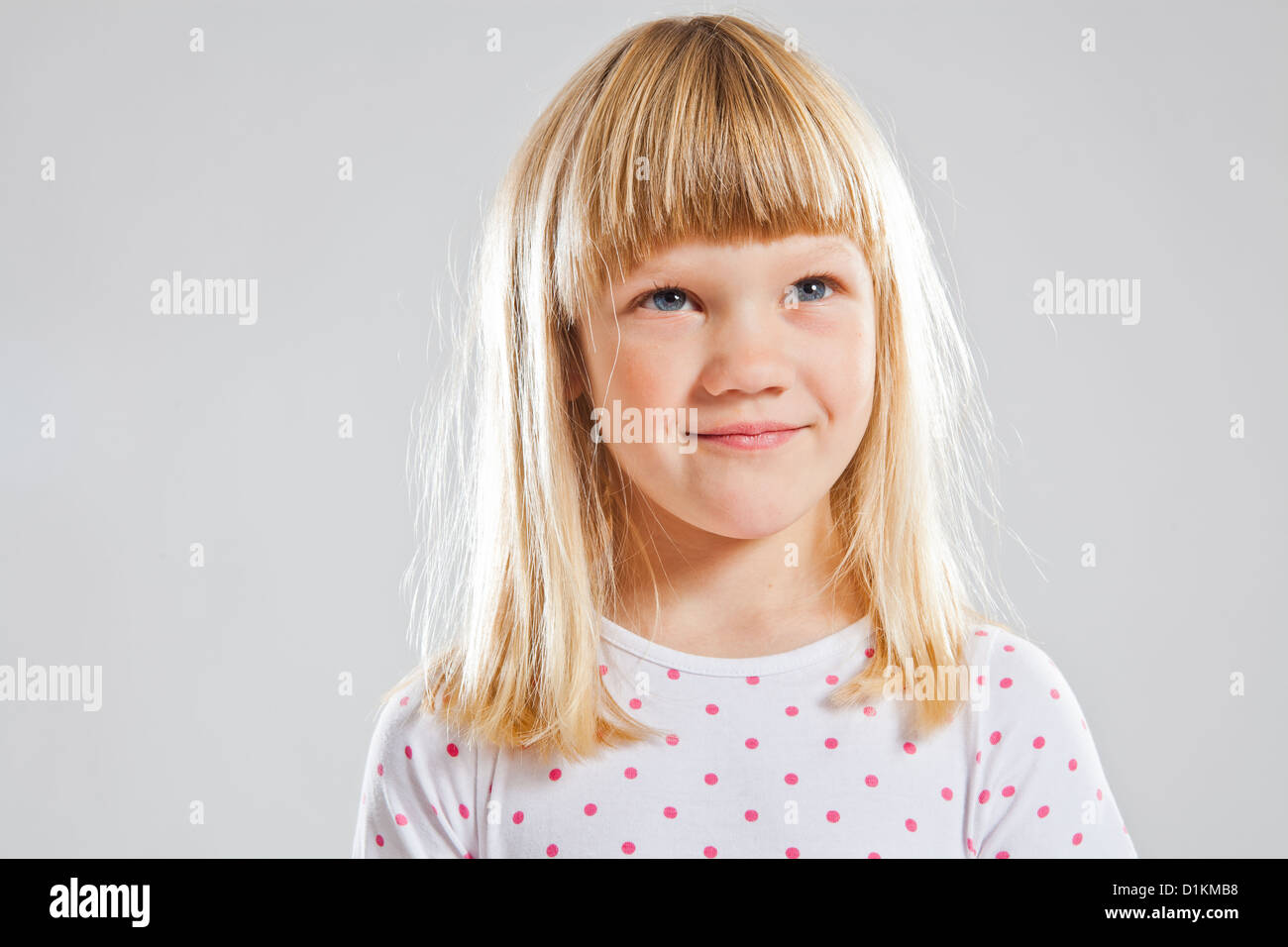 Studio portrait of happy smiling young girl Stock Photo - Alamy