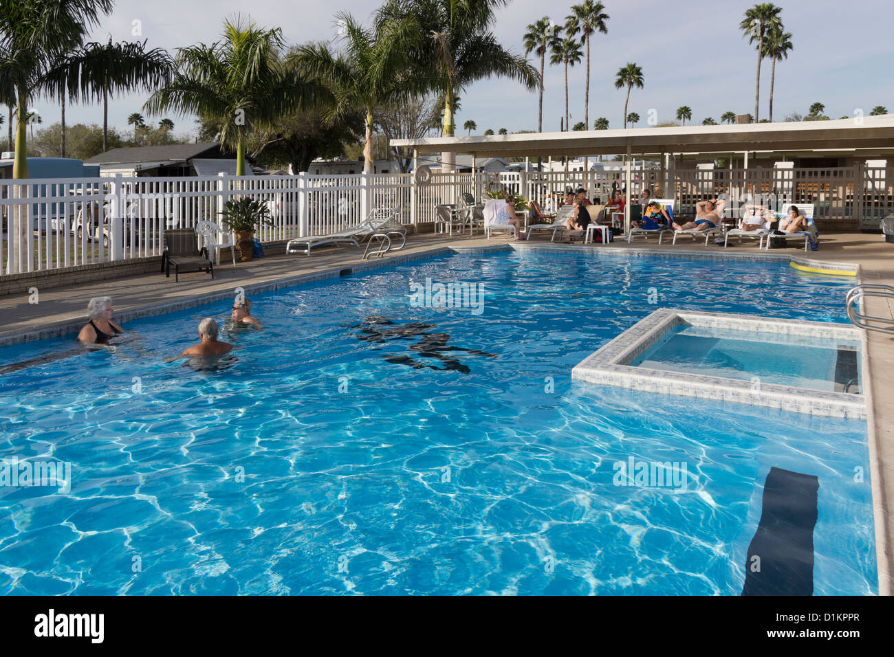 Senior citizens relaxing in a swimming pool at an RV resort in Mission