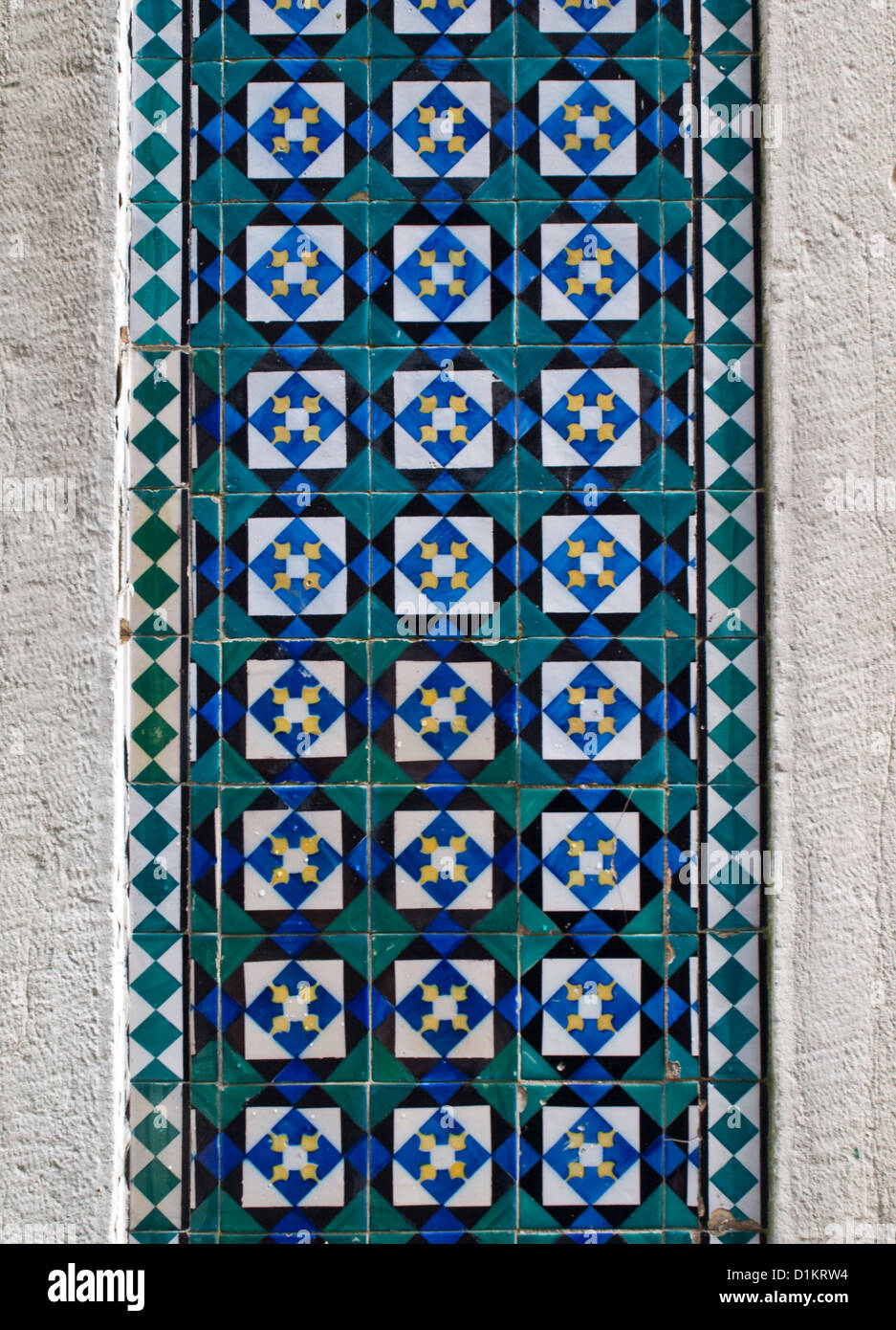 Traditional tiles from a Lisbon building with green, yellow and yellow geometric pattern Stock Photo