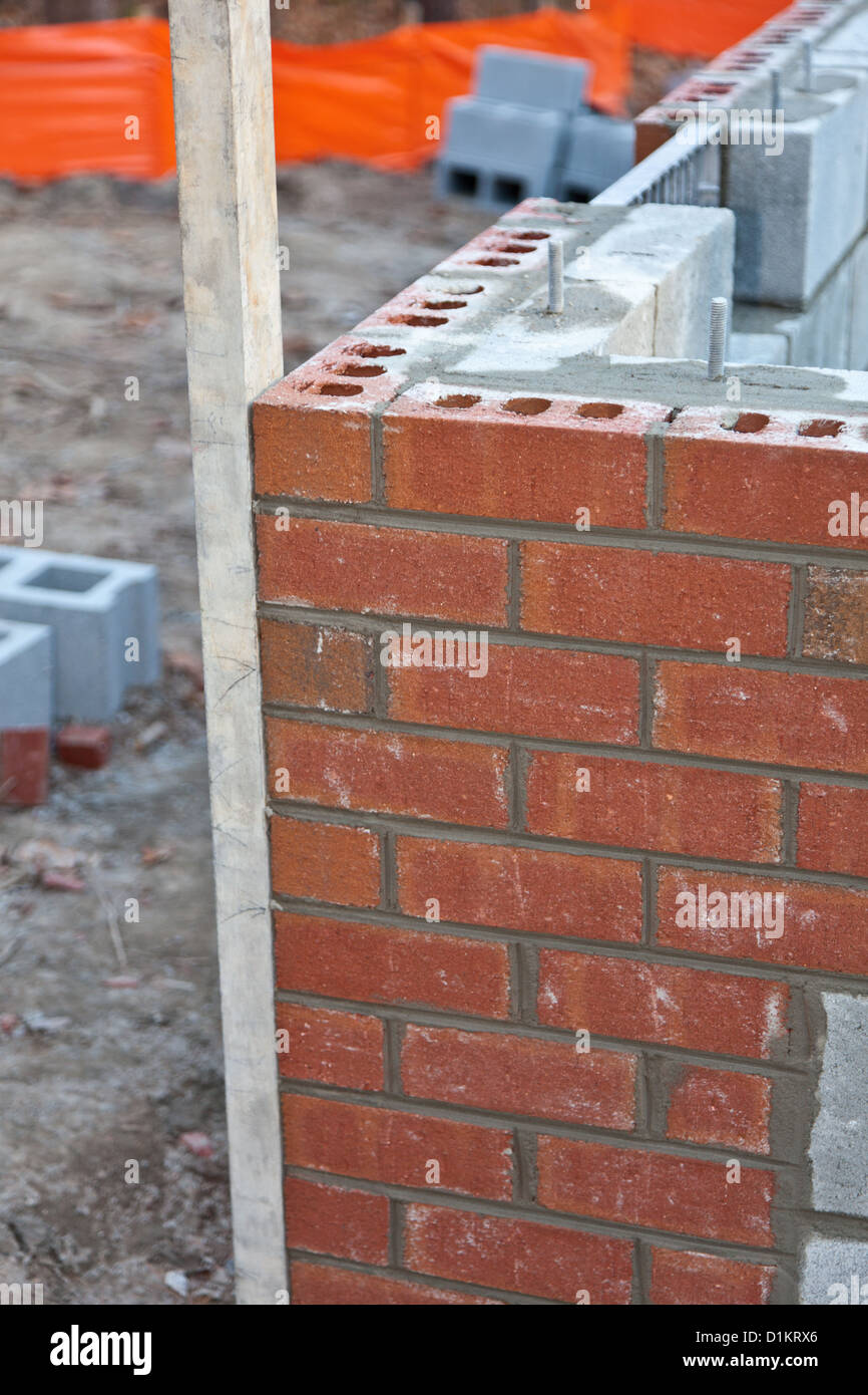 Keeping the corner of a new home plumb during contruction Stock Photo